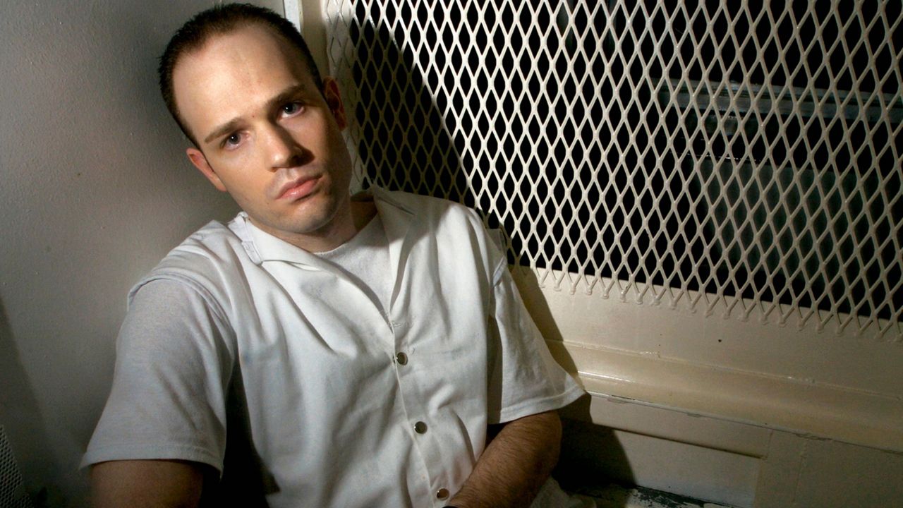 Death row inmate Randy Halprin, then 26, sits in a visitation cell at the Polunsky Unit in Livingston, Texas, Dec. 3, 2003. (AP Photo/Brett Coomer, File)