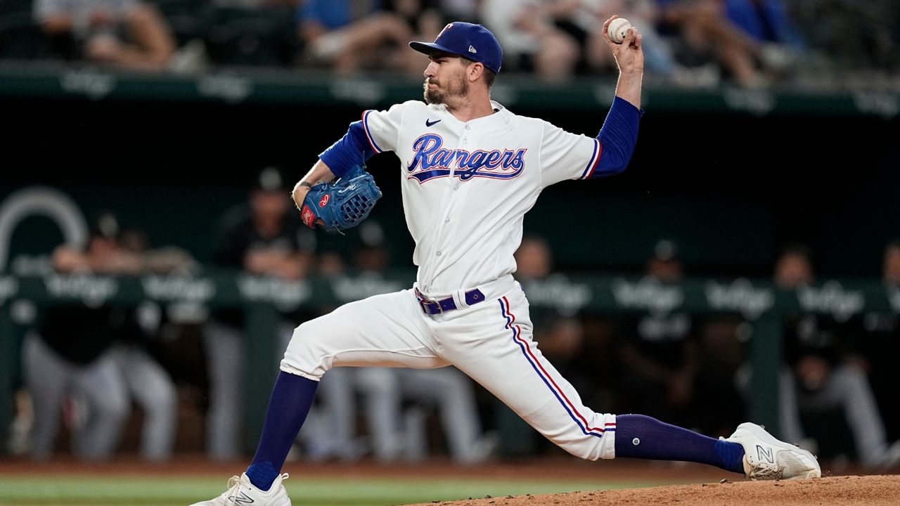 Texas Rangers' Jordan Montgomery walks to the dugout during a