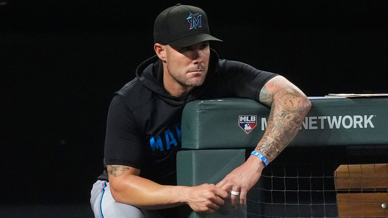 Miami Marlins manager Skip Schumaker looks on during the eighth inning of a baseball game against the Colorado Rockies, Aug. 27, 2024, in Denver. (AP Photo/David Zalubowski, File)