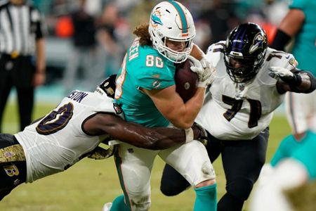 Miami Dolphins tight end Durham Smythe (81) walks on the field