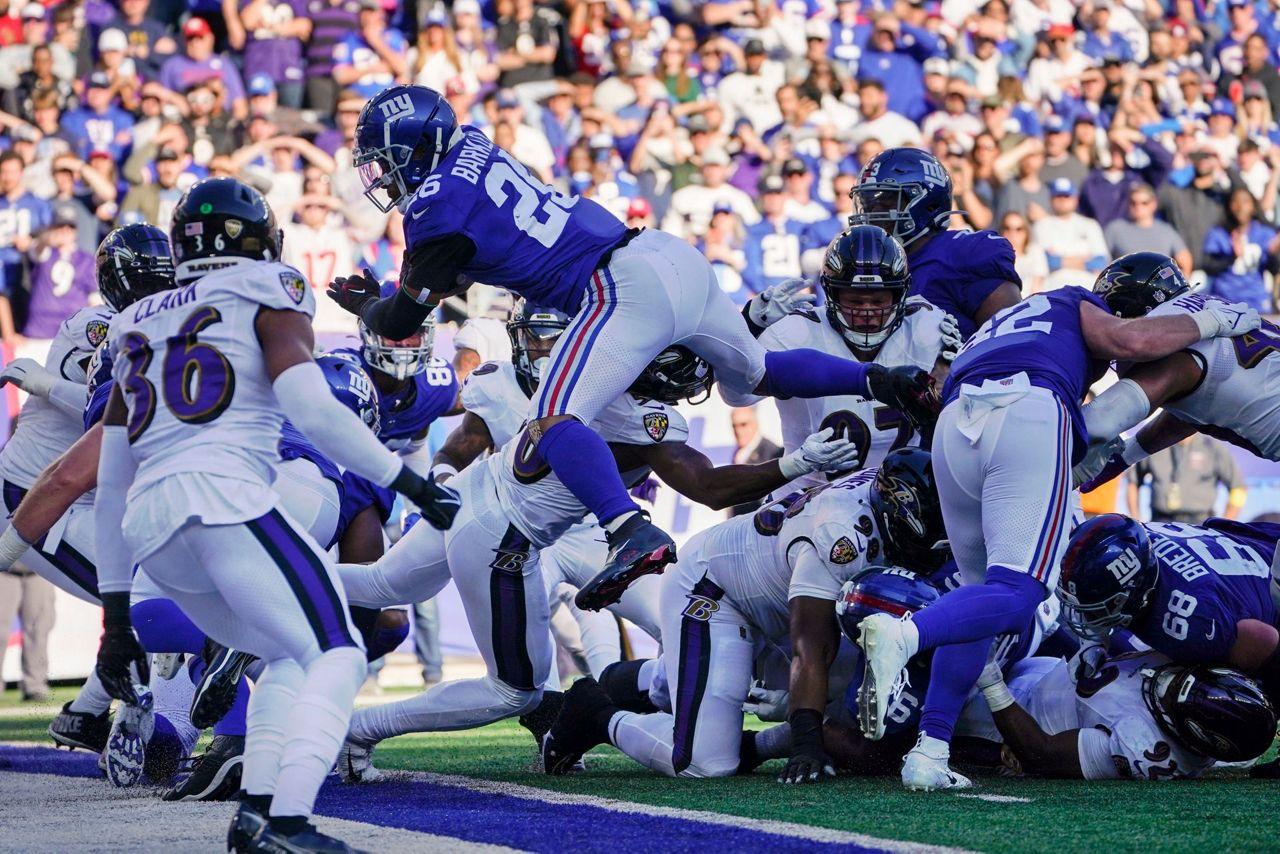 Baltimore Ravens safety Chuck Clark (36) grabs Cleveland Browns