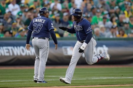 Tampa Bay Rays' Tommy Pham, right, is congratulated by Willy