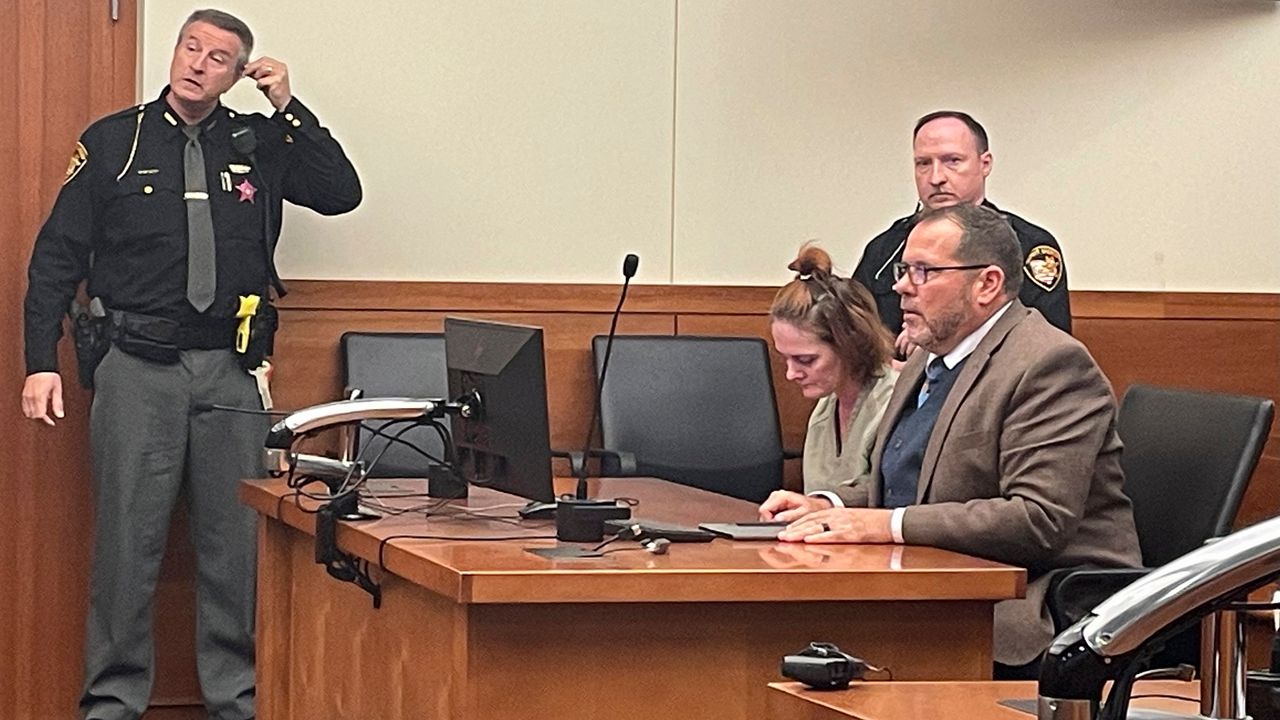 Rebecca Auborn, accused of killing four men by fatally drugging them to steal their possessions, sits in a Franklin County courtroom in Columbus, Ohio alongside her attorney, Mark Hunt on Monday, Oct. 30, 2023. Auborn pled not guilty to the deaths of the four men and a near fatal overdose of another, but investigators believe she has more alleged victims. (AP Photo/Samantha Hendrickson)