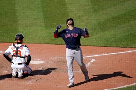 Boston Red Sox's J.D. Martinez celebrates after hitting a solo