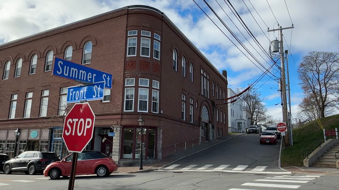 This redevelopment project in Bath, which features store fronts and 60 units of housing, is an example of what's needed across Maine to address the housing affordability crisis, officials said Wednesday. (Spectrum News/Susan Cover)