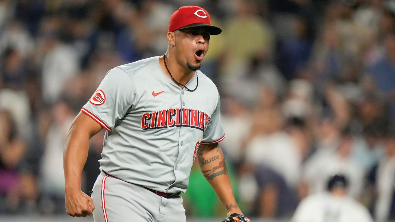 Cincinnati Reds pitcher Fernando Cruz reacts after New York Yankees' Aaron Judge hit into a double play during the seventh inning of a baseball game, Wednesday, July 3, 2024, in New York.