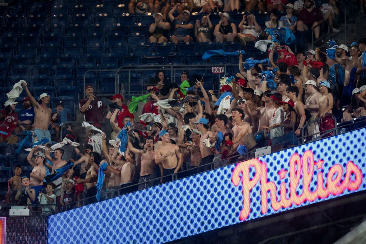 Shirtless fans the stars at MLB stadiums as 'Tarps Off' trend sweeps ...