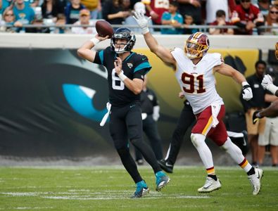 Johnson leads Redskins to late scores, 16-13 win at Jaguars