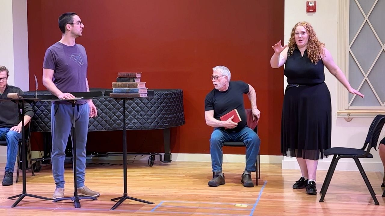 Performers rehearse Opera in the Pines' production of "The Crucible" at the Portland Conservatory of Music in Portland Friday. The company is presenting the opera this weekend in Standish. (Spectrum News/Sean Murphy)
