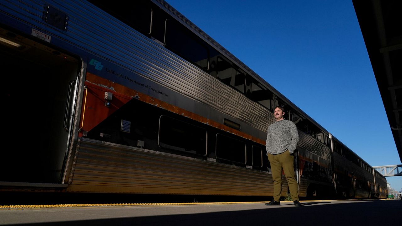 Jonah Paul, Digital Marketing Analyst at Employment Development Department, stands for photographs at the Jack London Square Amtrak Train station in Oakland, Calif., Friday, March 7, 2025. (AP Photo/Jeff Chiu)