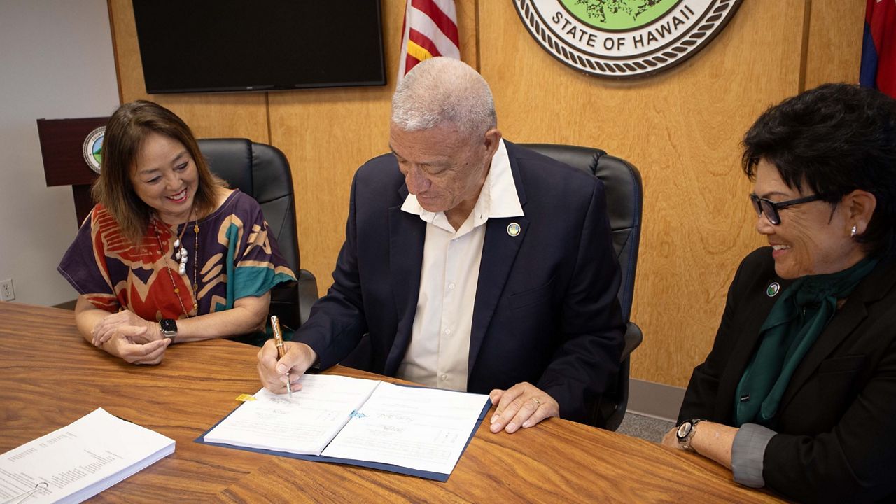 Flanked by Maui County Council members Yuki Lei Sugimura and Alice Lee, Maui Mayor Richard Bissen signed the $1.26B Fiscal Year 2025 budget on Wednesday. (County of Maui)