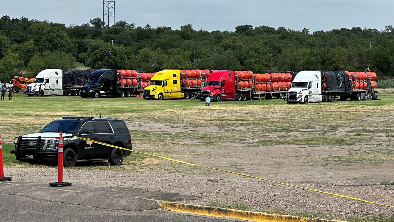 Buoys that will be placed in the Rio Grande arrive in Eagle Pass, Texas, by truck in this image from July 7, 2023. (Spectrum News 1/Ed Keiner)