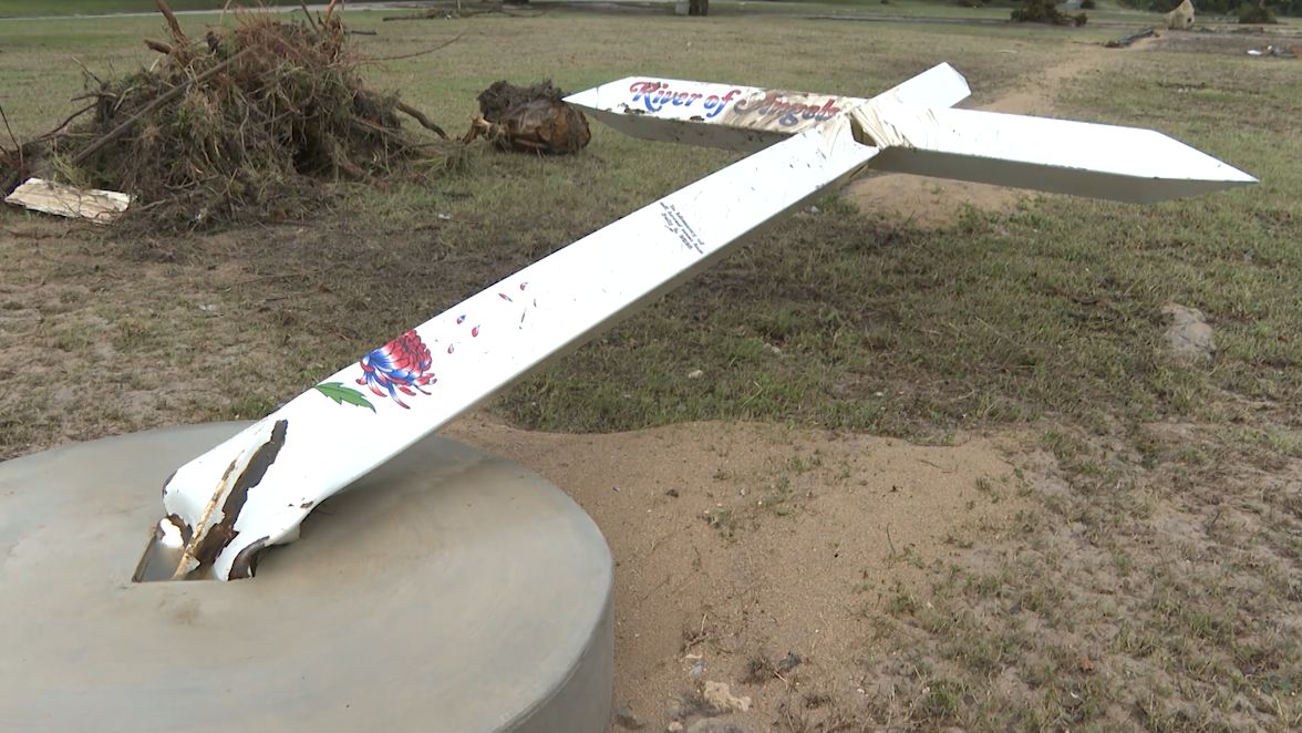 Memorial cross to honor flood victims damaged by yet another flood