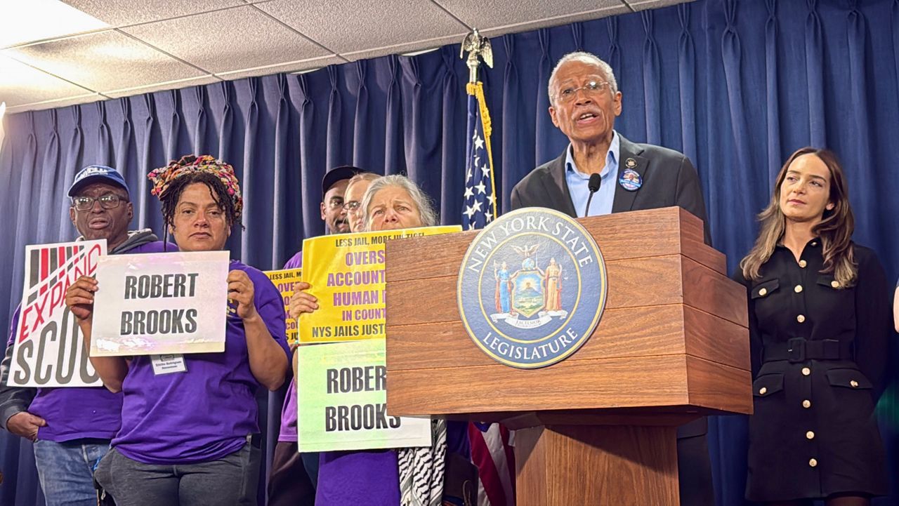 Sen. Robert Jackson speaks at a rally