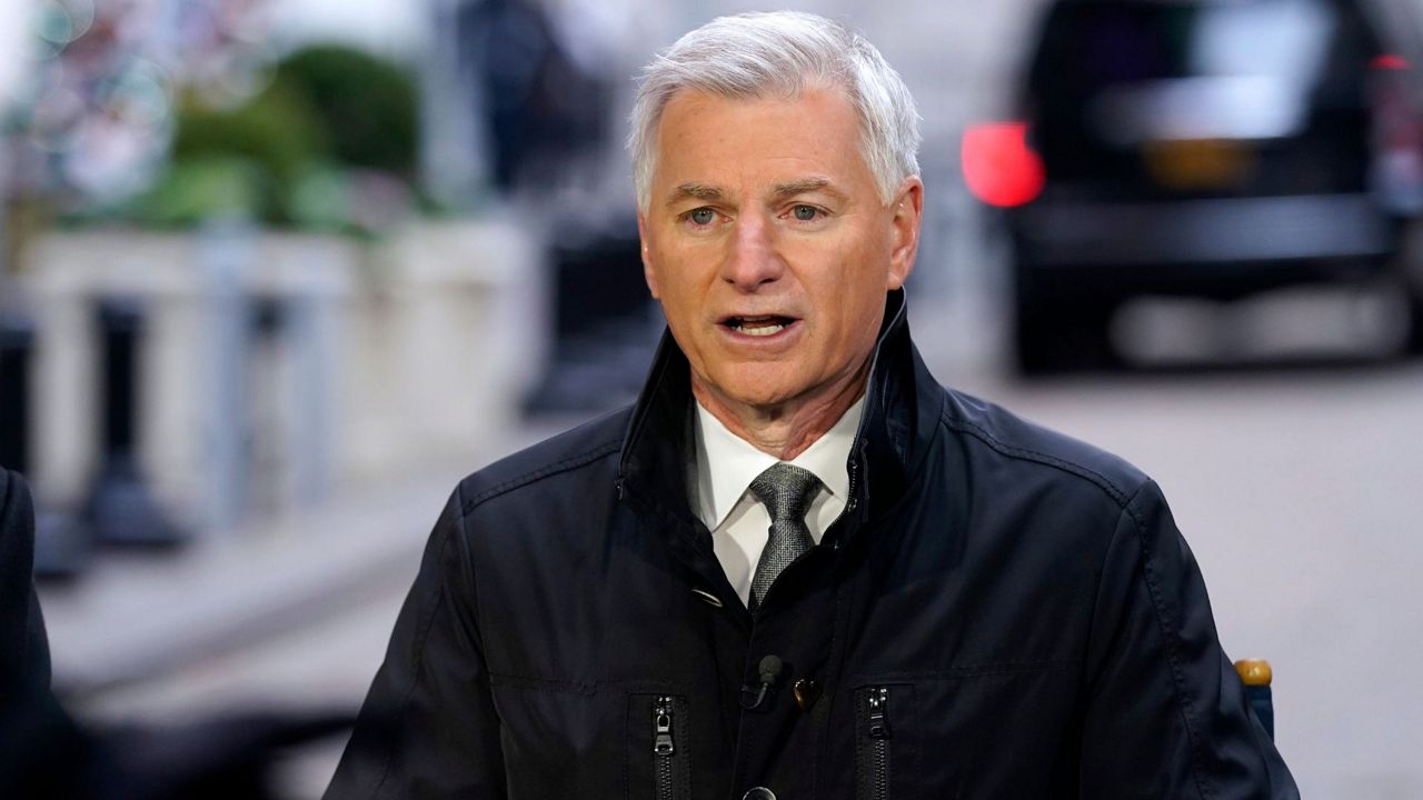 Robert Jordan, incoming Southwest Airlines CEO, is interviewed outside the New York Stock Exchange, Dec. 9, 2021. (AP Photo/Richard Drew, File)