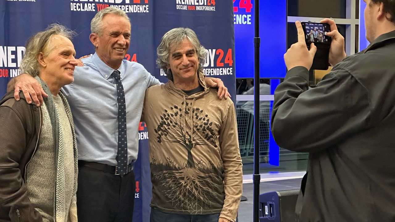 Independent presidential candidate Robert F. Kennedy Jr. poses for a photo with supporters Wednesday in Portland. (Spectrum News/Susan Cover)
