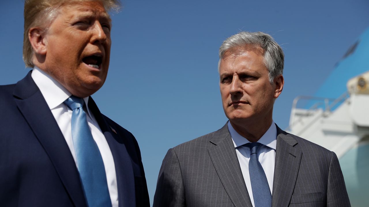 President Donald Trump and Robert O'Brien, just named as the new national security adviser, speak to the media at Los Angeles International Airport, Wednesday, Sept. 18, 2019, in Los Angeles. (AP Photo/Evan Vucci)