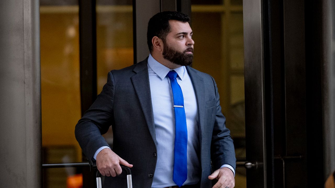 Roberto Minuta of Prosper, Texas, leaves federal court in Washington, Jan. 23, 2023. Minuta, a member of the far-right Oath Keepers extremist group who was part of a security detail for former President Donald Trump's longtime adviser Roger Stone before storming the U.S. Capitol, was sentenced on Thursday to more than four years in prison. (AP Photo/Andrew Harnik, File)