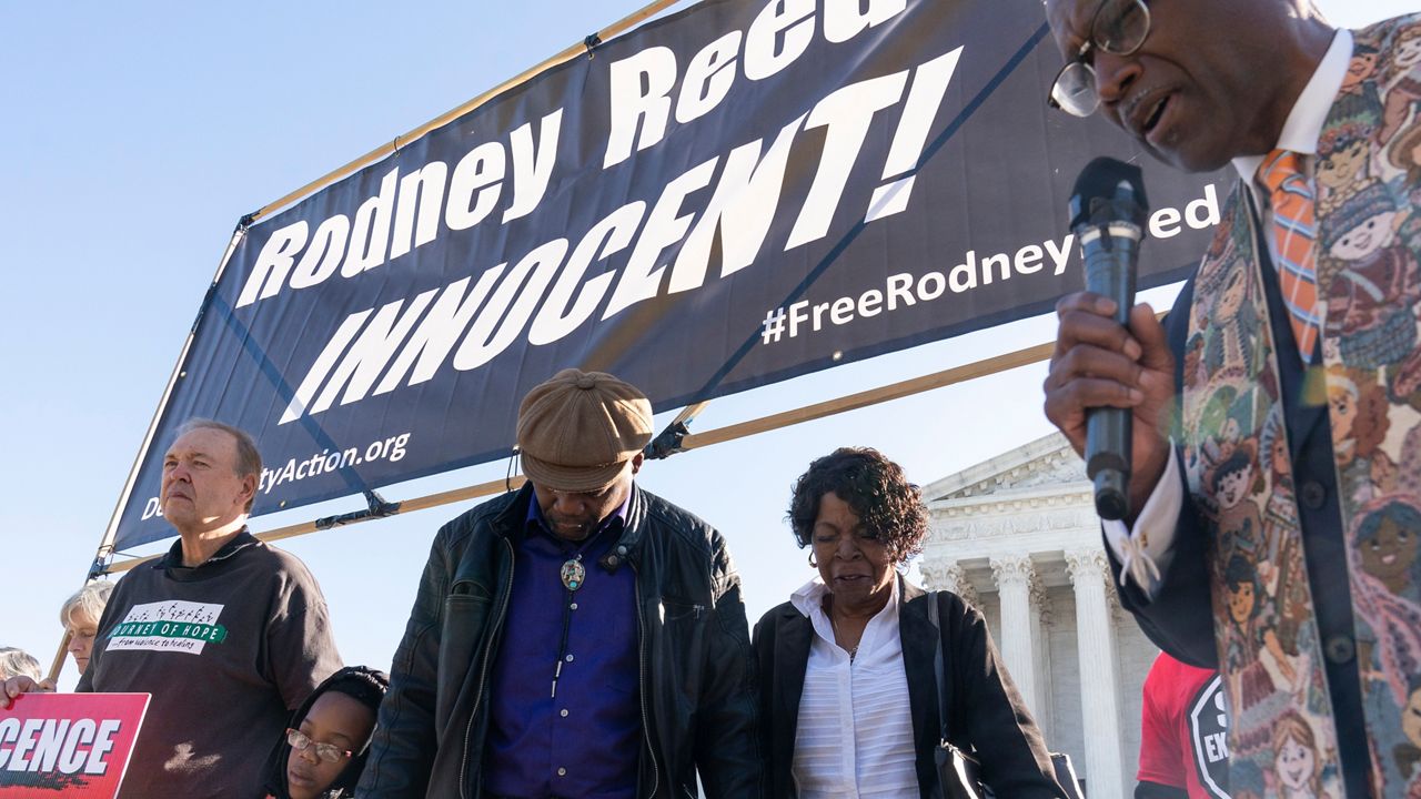 Texas death row prisoner Rodney Reed's mother, Sandra Reed, second from right, brother Roderick Reed, center, and other family members join faith leaders and supporters for a prayer rally organized by Death Penalty Action, in front of the U.S. Supreme Court prior to attending arguments in Rodney Reed v. Bryan Goertz case in Washington. (AP Photo/Alex Brandon)