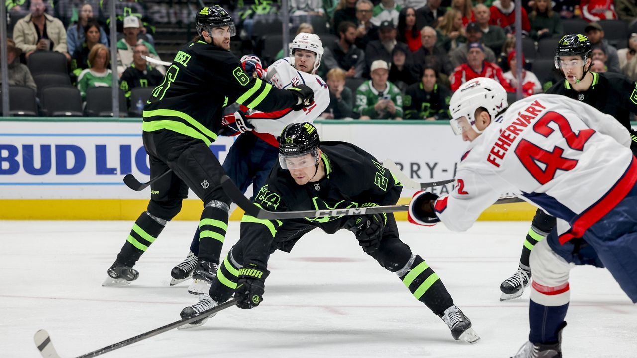 Dallas Stars center Roope Hintz (24) blocks a shot by Washington Capitals defenseman Martin Fehervary (42) during the second period of an NHL hockey game in Dallas, Monday, Dec. 16, 2024. (AP Photo/Gareth Patterson)