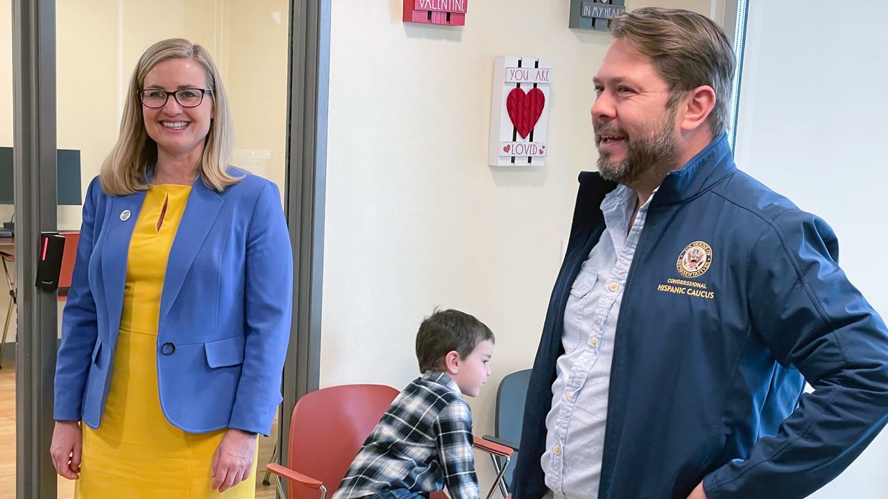 U.S. Rep. Ruben Gallego, D-Ariz., and his ex-wife, Phoenix Mayor Kate Gallego, tour an affordable housing development in Phoenix along with their 6-year-old son, Michael Gallego, on March 19, 2023. Kate Gallego on Monday endorsed Ruben Gallego's U.S. Senate run, helping him blunt a potential liability after the couple divorced weeks before their child was born. (AP Photo/Jonathan J. Cooper, file)