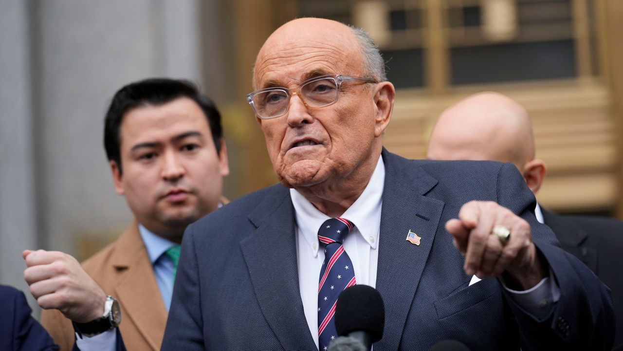 Rudy Giuliani speaks to reporters as he leaves the federal courthouse in New York, Tuesday, Nov. 26, 2024. (AP Photo/Seth Wenig)