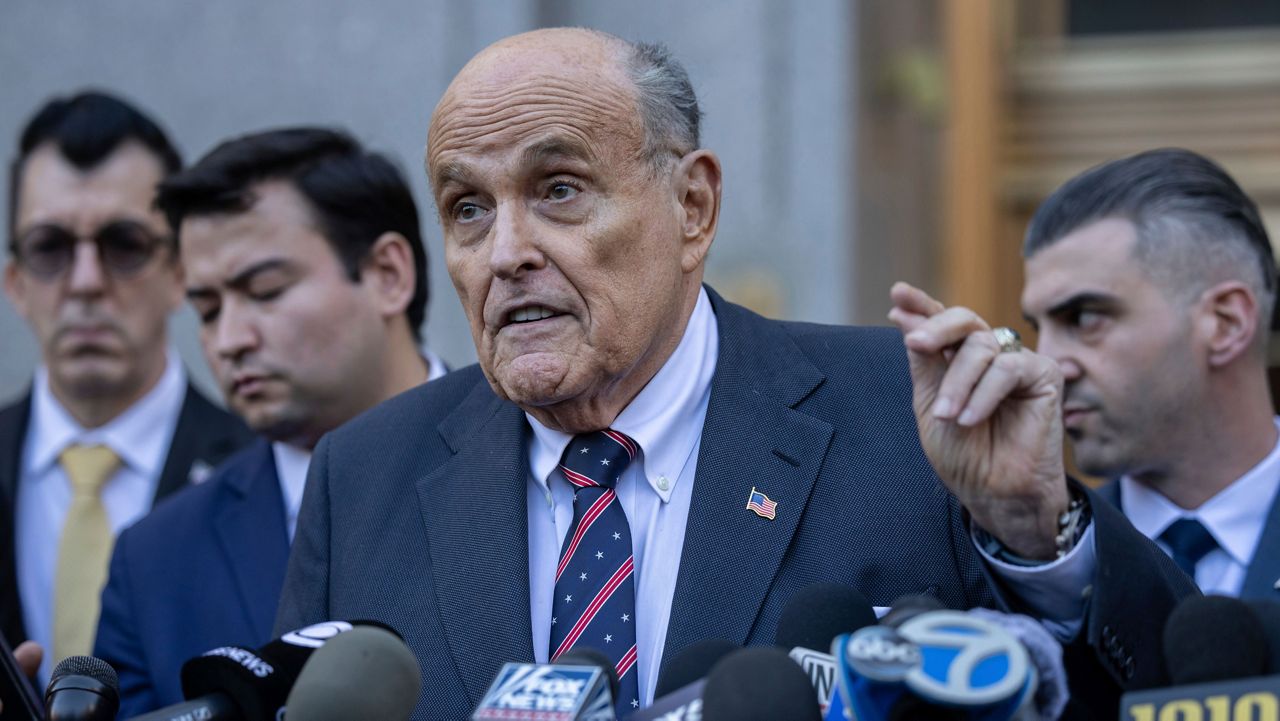 Former New York City Mayor Rudy Giuliani speaks to the members of the media as he leaves court in New York, Thursday, Nov. 7, 2024. (AP Photo/Yuki Iwamura)