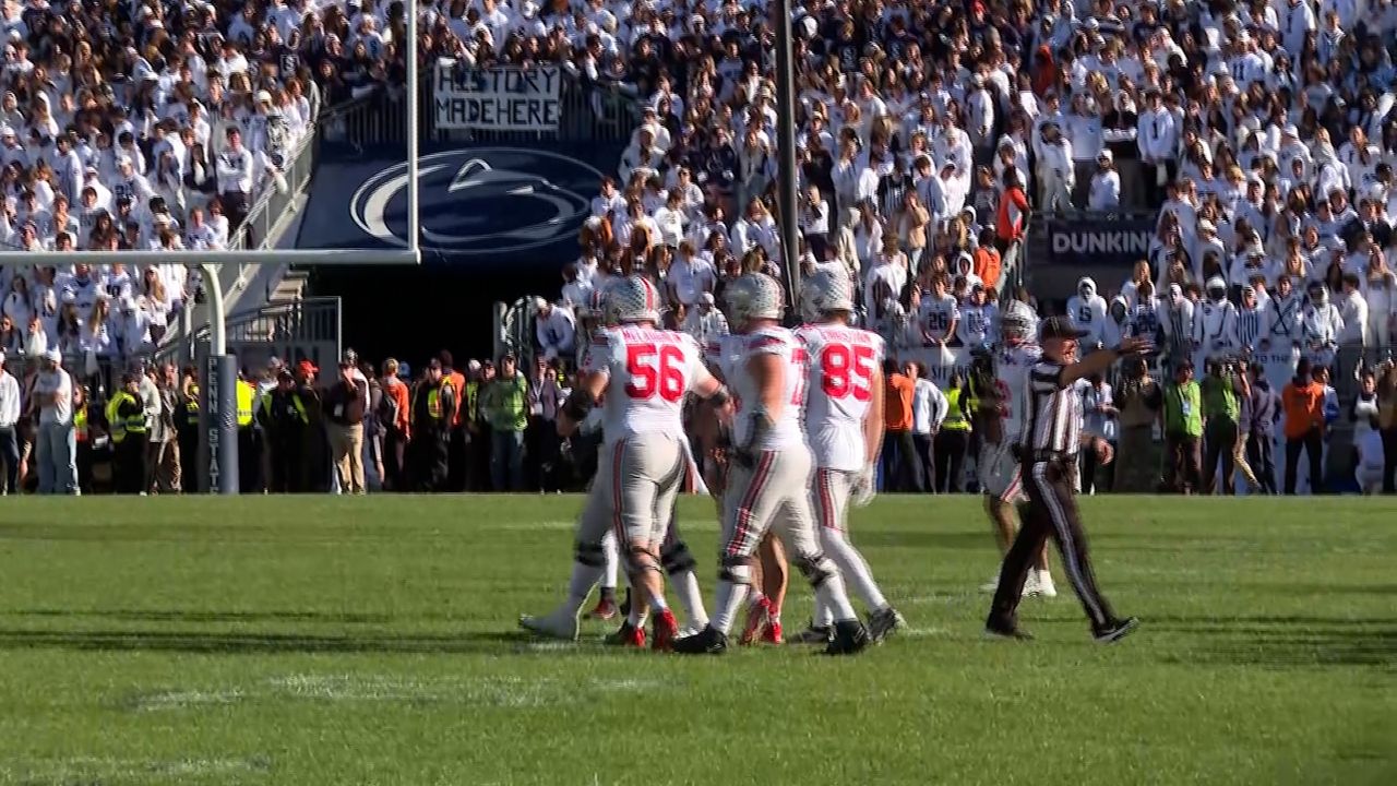 McLaughlin (56) celebrates with his team after beating Penn State this season.