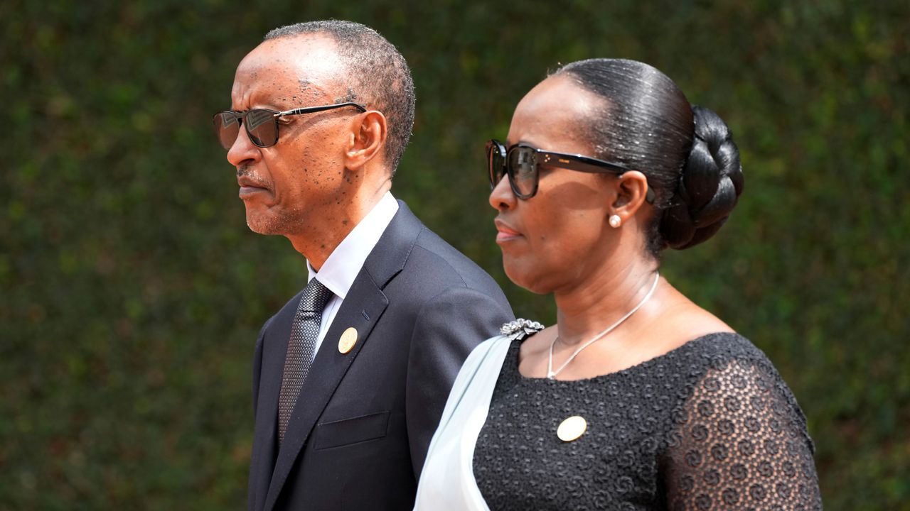 Rwandan President Paul Kagame, left, and his wife, first lady Jeannette Kagame arrive for a ceremony to mark the 30th anniversary of the Rwandan genocide, held at the Kigali Genocide Memorial, in Kigali, Rwanda, Sunday, April 7, 2024. Rwandans are commemorating 30 years since the genocide in which an estimated 800,000 people were killed by government-backed extremists, shattering this small east African country that continues to grapple with the horrific legacy of the massacres. (AP Photo/Brian Inganga)