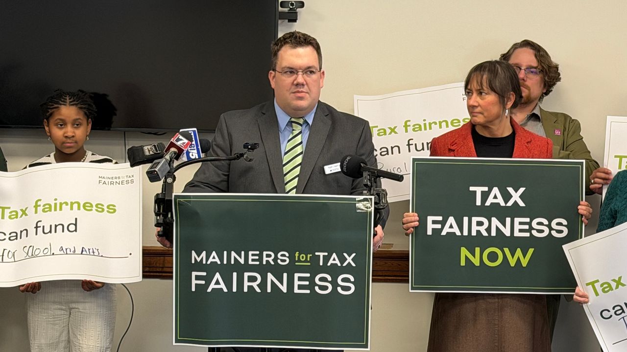 Ryan Tipping, director of campaigns and strategy for the Maine Center for Economic Policy, talks about tax legislation last week at the State House. (Spectrum News/Susan Cover)