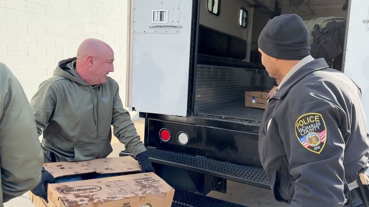 St Charles County Police loading up the SWAT truck with 280 turkeys to help families in need have a tasty Thanksgiving (Spectrum News / John Gerding)