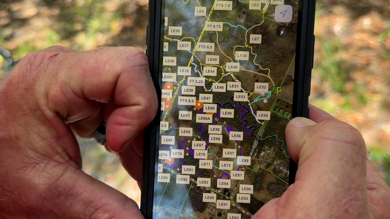 Lt. Ed Castlen shows Spectrum News 13 their internal app, which includes coordinates, names, and emergency markers to help crews. (Spectrum News 13/Emma Delamo)