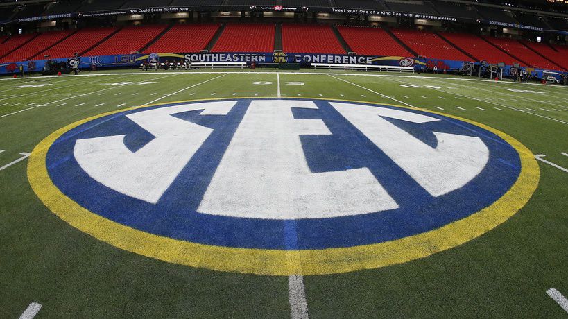 The SEC logo is displayed on the field ahead of the Southeastern Conference championship football game between Alabama and Missouri on Dec. 5, 2014, in Atlanta. (AP Photo/John Bazemore, File)