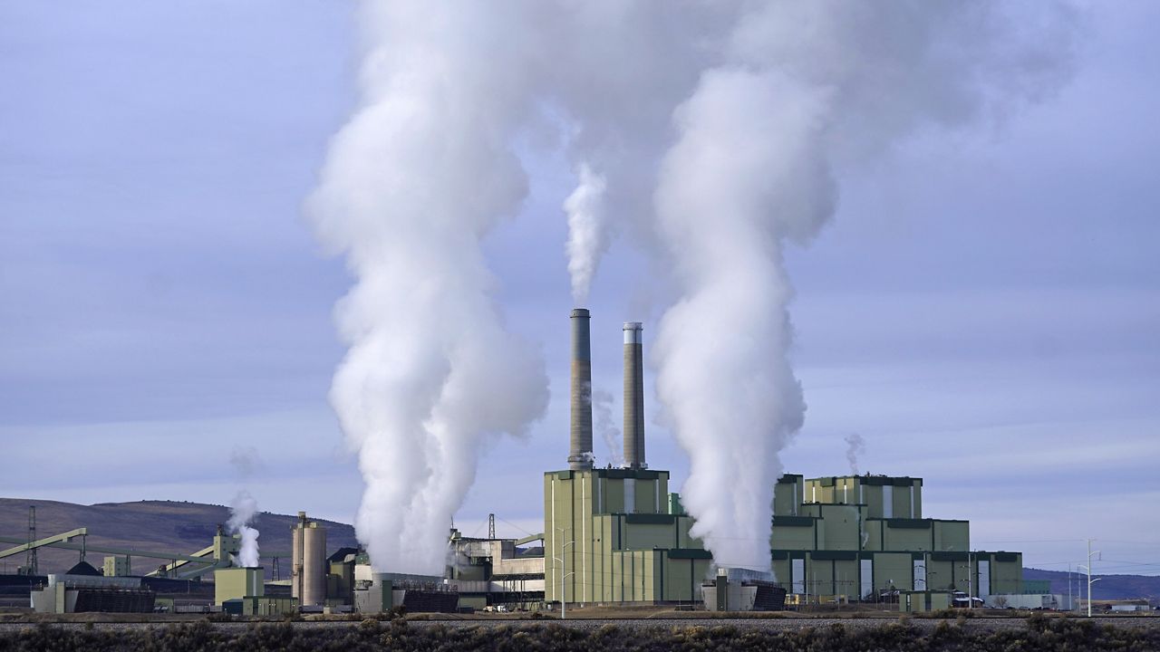 FILE - Steam billows from a coal-fired power plant Nov. 18, 2021, in Craig, Colo. The U.S. Securities and Exchange Commission on Wednesday, March 6, 2024, approved a rule that will require some public companies to report their greenhouse gas emissions and other climate risks. (AP Photo/Rick Bowmer, File)