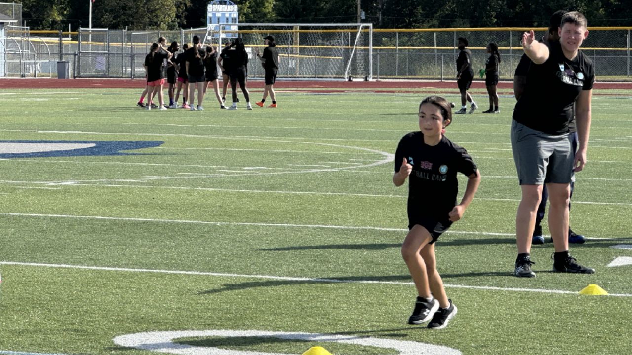 young girls practicing football