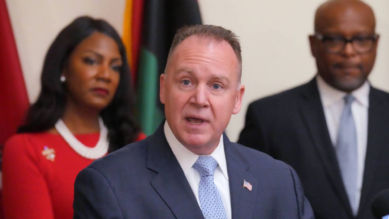 St. Louis Mayor Tishaura O. Jones and Dr. Dan Isom, Director of St. Louis Public Safety, listen as former Wilmington, Delaware Chief of Police Robert Tracy makes his remarks after being appointed to head the St. Louis Metropolitian Polce Department, during a press conference in St. Louis on Wednesday, December 14, 2022. 