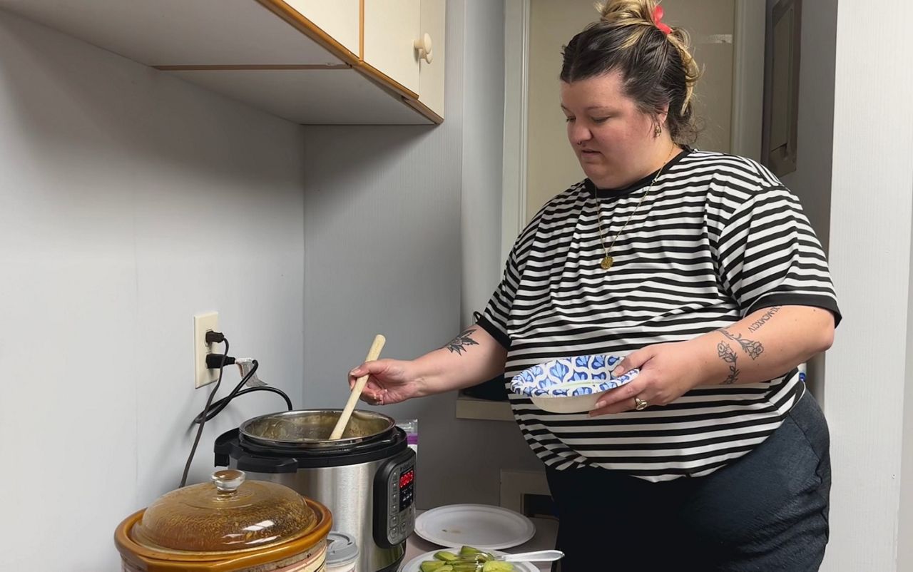 THP Member helping serve soup in their community event.