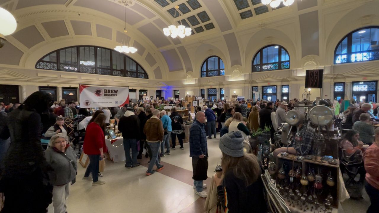 People browse various crafts and ornaments at the annual 'stART at the Station' event at Union Station in Worcester. (Spectrum News 1/Devin Bates)