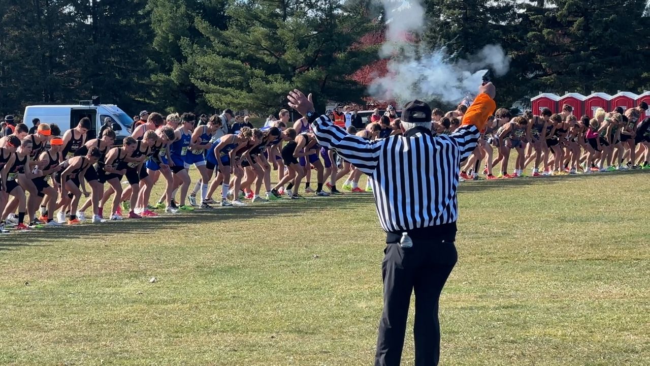 Two cross-country runners bring home gold after years of fighting to get over the hump
