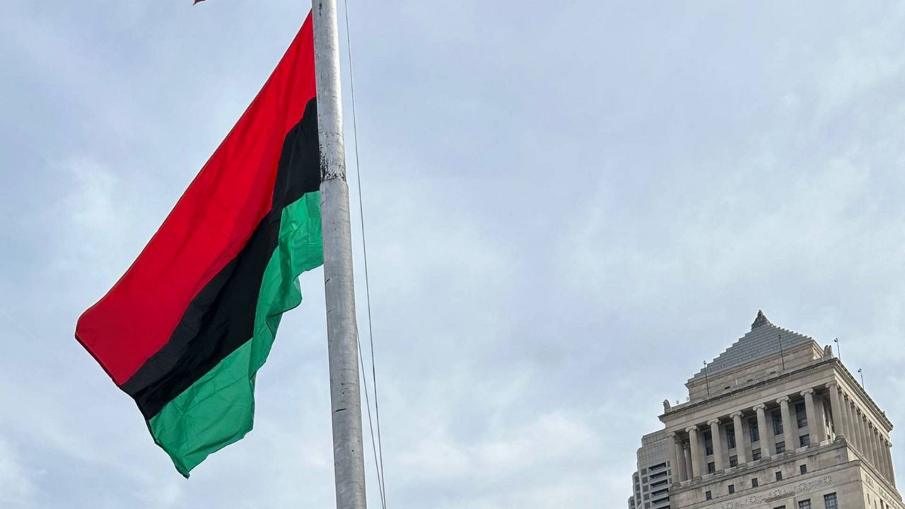 The African-American Heritage flag flies in front of the Civil Courts building in Downtown, St. Louis (Office of Mayor Tishaura Jones)