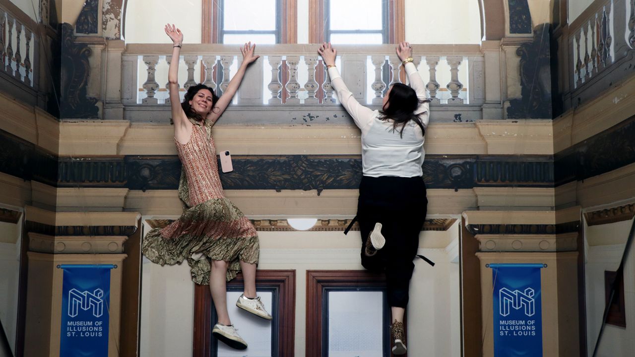 A visual perception is created to look like people are hanging from an interpretation of St. Louis City Hall at the new Museum of Illusions, which is set to open Friday, May 24, at City Foundry. (Spectrum News/Elizabeth Barmeier)