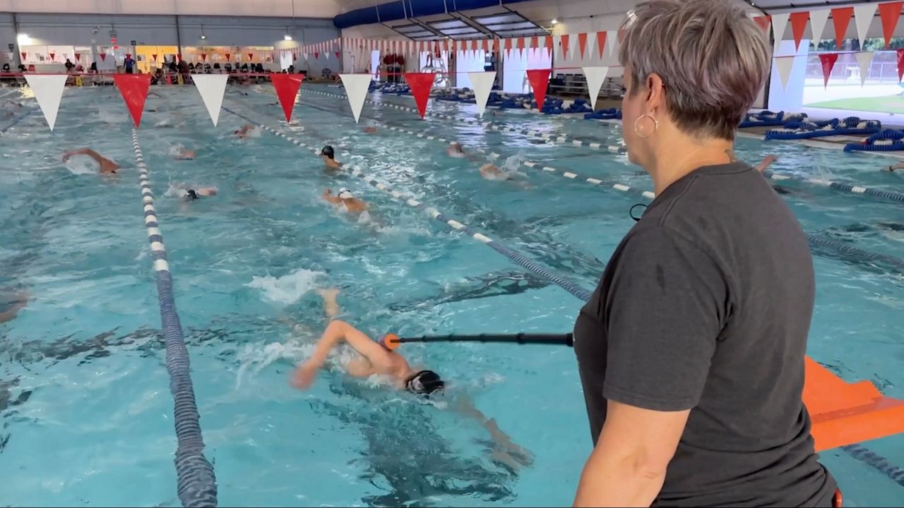 A tapper lets Evan Wilkerson know when he gets to the end of the lane. (Spectrum News 1/Jenna Rae Gaertner)