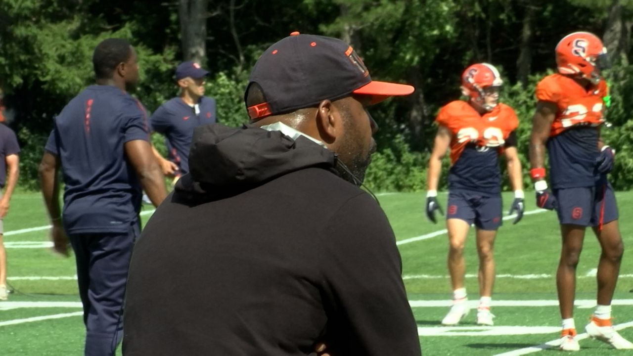 Fran Brown directs a drill in practice on Monday (Jesse MacWilliam - Spectrum News 1)