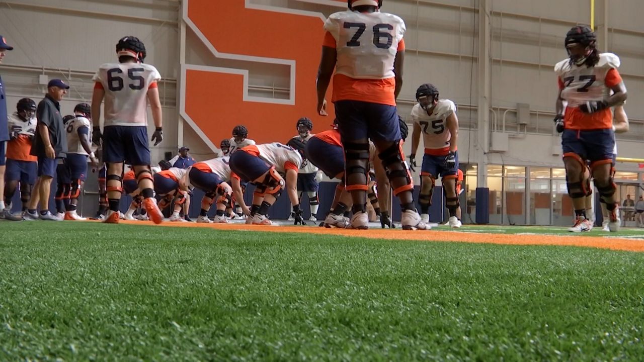 The offensive line puts in work at Fall camp (Jesse MacWilliam - Spectrum News 1)