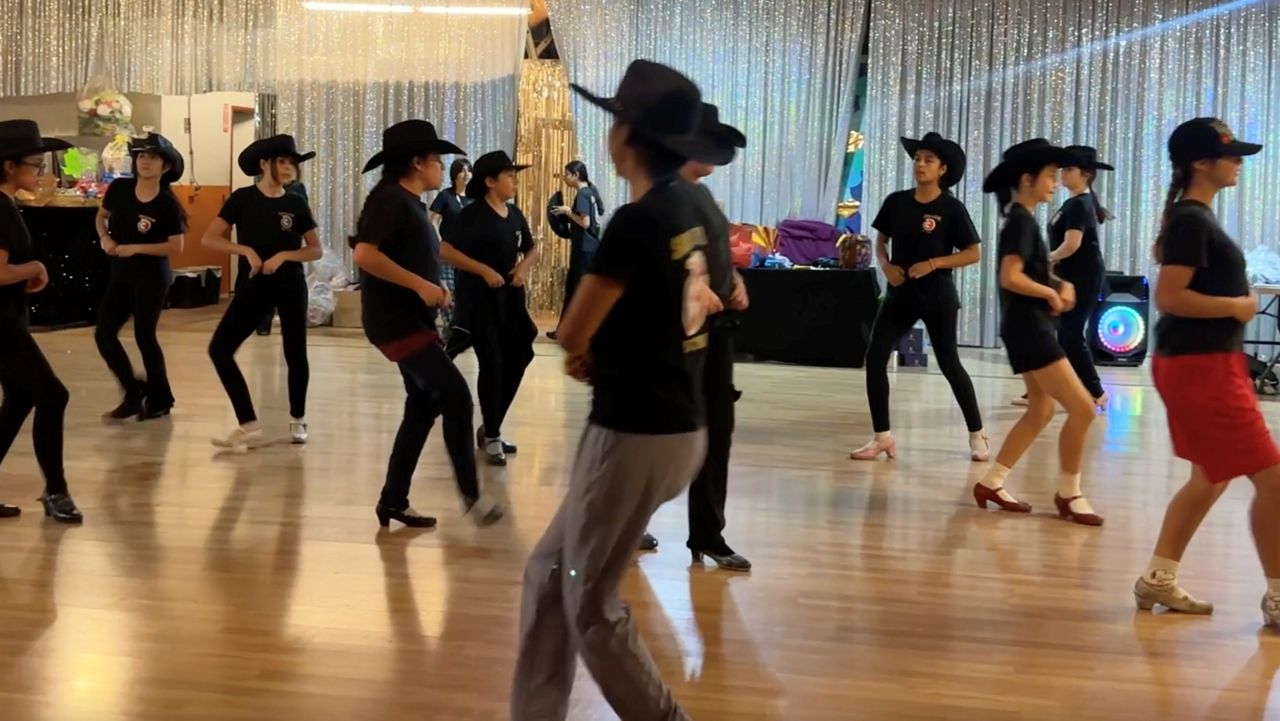 Sabor de Mexico dancers practicing their holiday routines. 