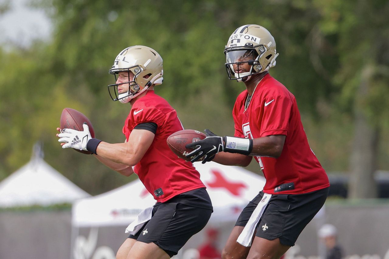 New Orleans Saints quarterback Taysom Hill throws a pass against