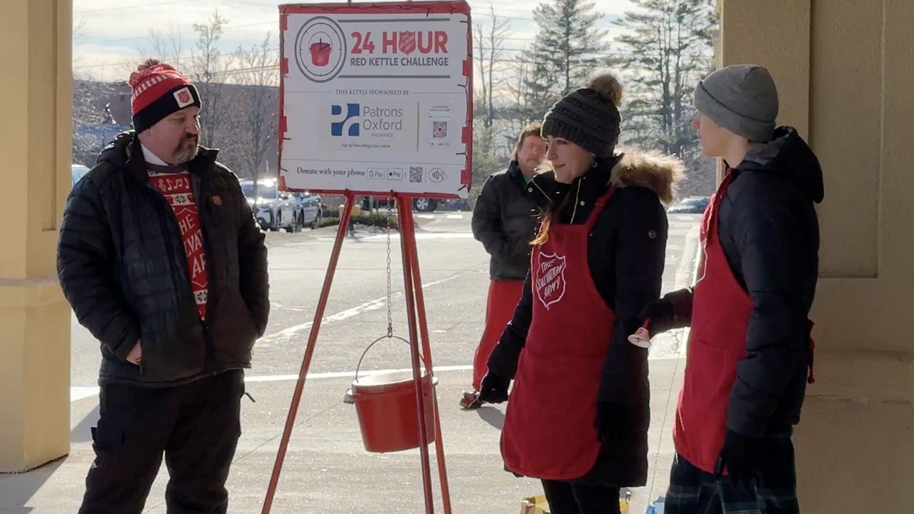 Salvation Army Major Keith Jache with members of the organization outside Walmart in Falmouth on Dec. 23. The organization is raising money for its $150,000 goal, and has currently raised more than $100,000 over the last month. (Spectrum News/Matthew Jaroncyk)