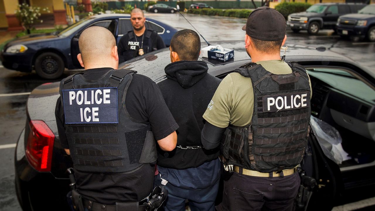 In this Tuesday, Feb. 7, 2017, photo released by U.S. Immigration and Customs Enforcement, foreign nationals are arrested during a targeted enforcement operation conducted by U.S. Immigration and Customs Enforcement (ICE) aimed at immigration fugitives, re-entrants and at-large criminal aliens in Los Angeles.  (Charles Reed/U.S. Immigration and Customs Enforcement via AP)