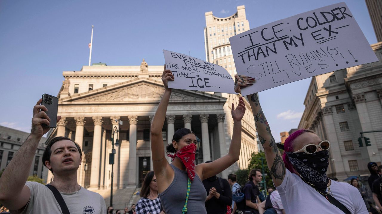 Demonstrators hold signs and chant during a protest against deportation by Immigration and Customs Enforcement in New York, Wednesday, June 11, 2025. (AP Photo/Yuki Iwamura)