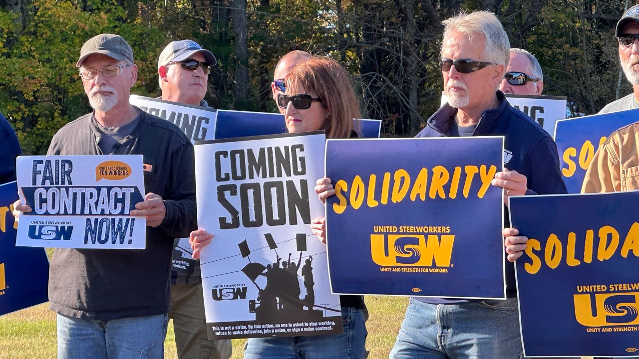 Sappi paper mill workers rally Tuesday outside their union hall in Skowhegan to draw attention to concerns about overtime and health insurance costs. (Spectrum News/Susan Cover)